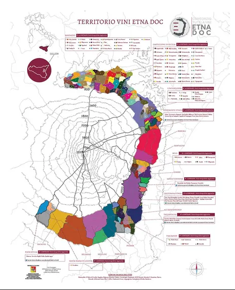 A printed map titled 'Territorio Vini Etna DOC' showing the denomination's contrade in coloured blocks around the volcano.